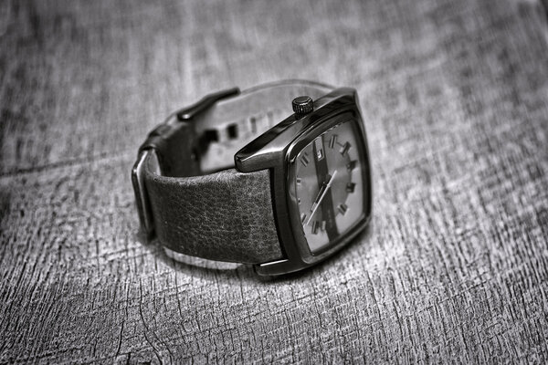 men's watch on the table. elegant brutal watch closeup on table