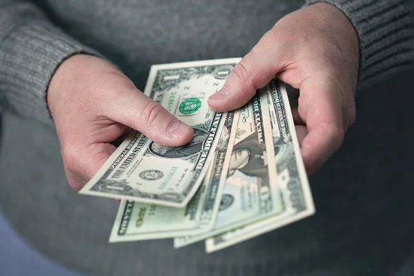 Male hands holding dollars — Stock Photo, Image