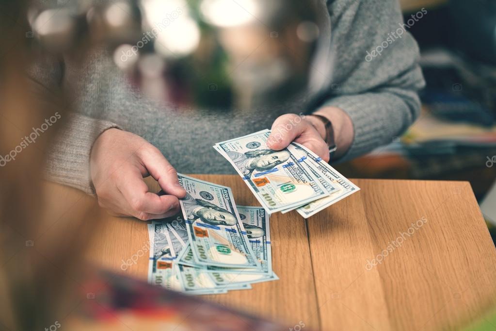 A Wealthy Man Counts Dollars Hands And 100 Dollar Bills Close Up To Peek Behind The Man Stock Photo Image By C Devin Pavel