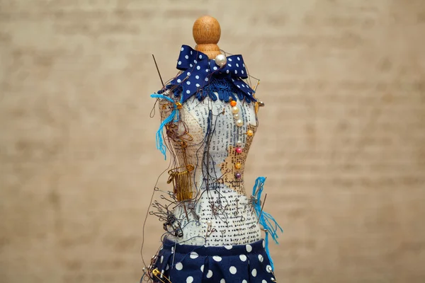 decorative figure of a woman - the pin cushion and pins