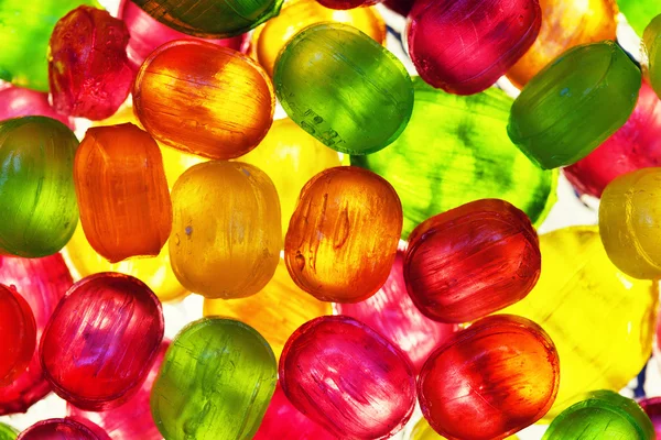 El fondo de la dispersión de caramelos multicolores — Foto de Stock