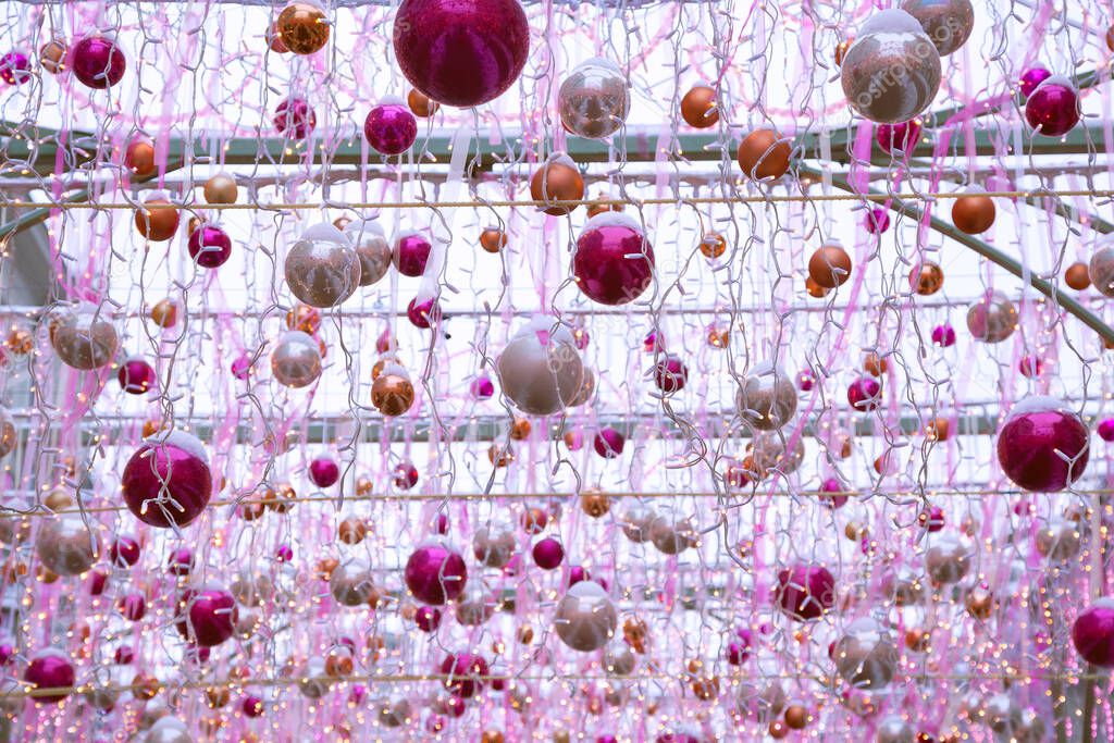 Christmas decoration of city streets with colorful Christmas balls