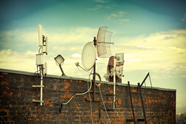 Satellite dishes on the roof clipart