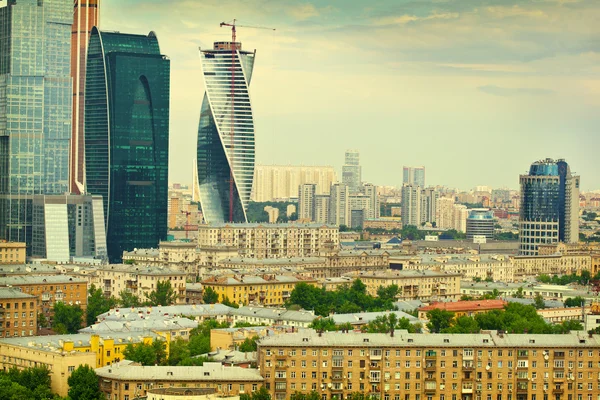 The Moscow city landscape. View of the historical Moscow and modern business center Moscow-City. Photo tinted in yellow — Stock Photo, Image