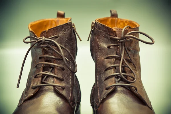 High leather shoes with laces close up, photo tinted in green — Stock Photo, Image
