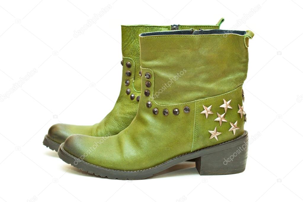 Women's fashion shoes green isolated on white background. Cowboy boots with stars and studs. Autumn - spring leather shoes