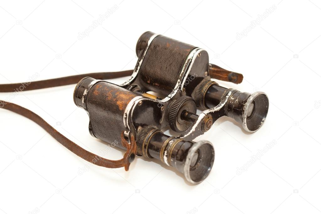 Old vintage binoculars since World War II isolated on white background