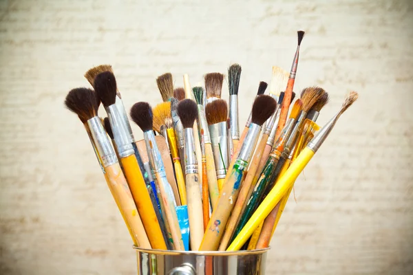 Paint brushes on abstract background — Stock Photo, Image