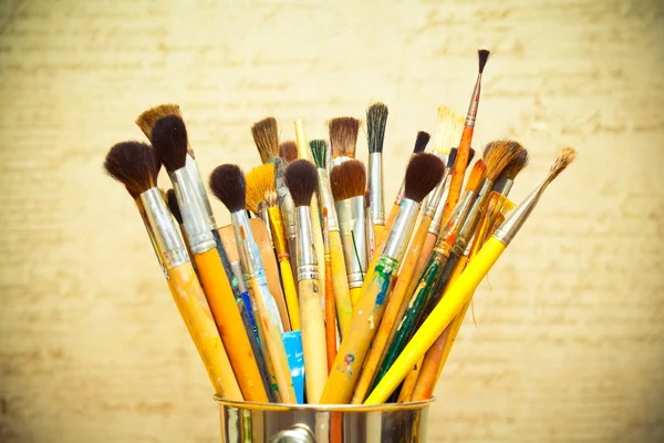 Paint brushes. instrument of the artist. photo toned yellow — Stock Photo, Image