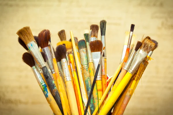 Paint brushes. instrument of the artist. photo toned yellow — Stock Photo, Image