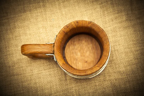 Wooden mug top view. Photo toned in yellow — Stock Photo, Image