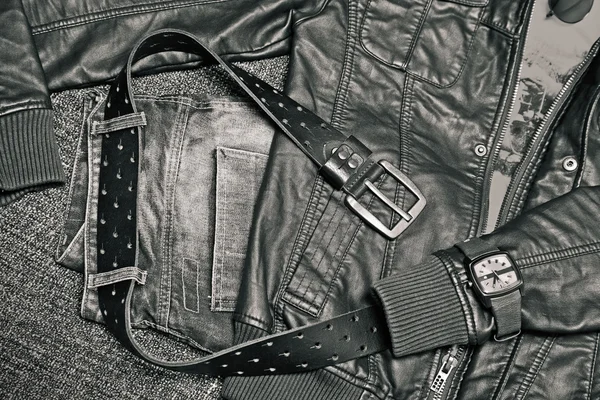 Urban fashion clothing: leather jacket, jeans, belt, watch. — Stock Photo, Image