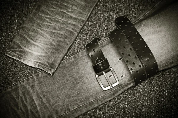 Fashion jeans, a leather belt with a buckle — Stock Photo, Image