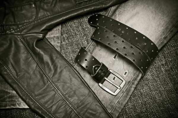 Fashion trend - jeans, leather jacket, leather belt with a buckle — Stock Photo, Image