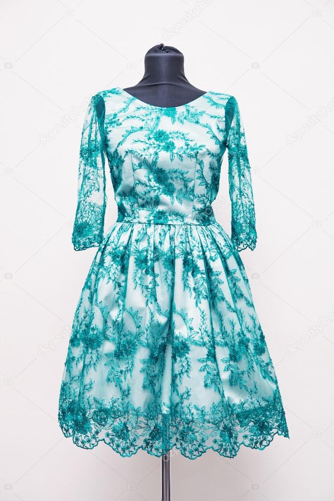Lace dress turquoise on a mannequin