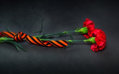 George Ribbon and flowers in memory of the victory in World War II. Victory Day on May 9th. clipart