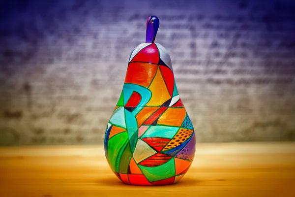 Decorative colorful fruit pear made of wood, hand-painted. Modern art — Stock Photo, Image