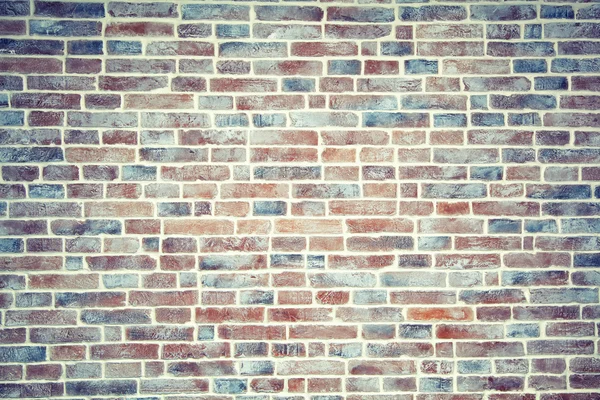 Artificially aged brick wall background — Stock Photo, Image