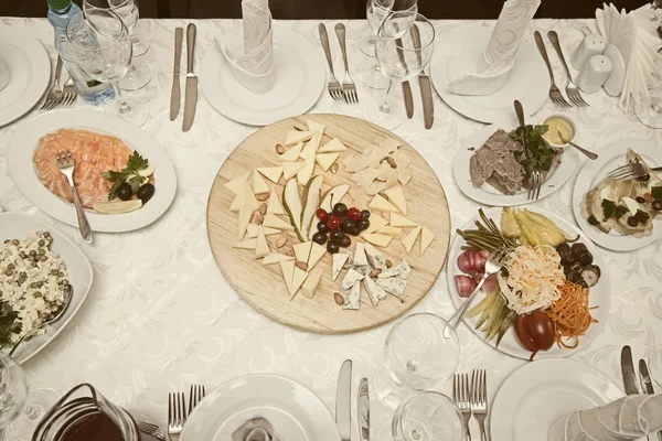 Banquet table with the dishes in the restaurant view from above