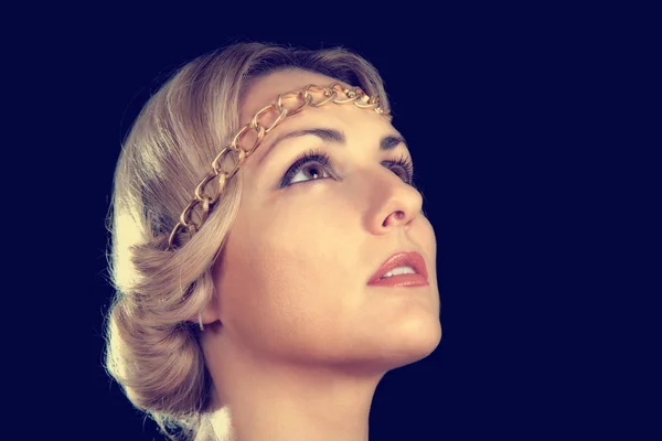 Portrait of a girl in the Greek style with a rim-chain on his head on a black background — Stock Photo, Image