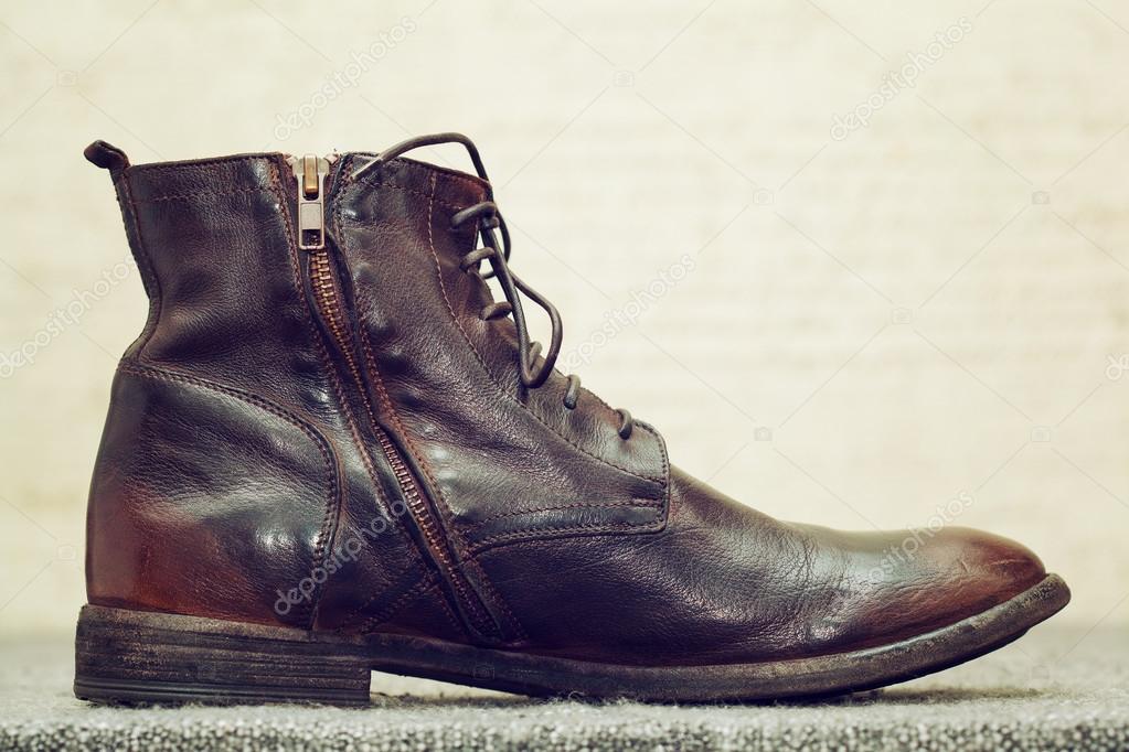 Fashionable leather high shoes brown with laces and zip fastener. Handmade  shoes, stylized vintage style Stock Photo by ©Devin_Pavel 88323684