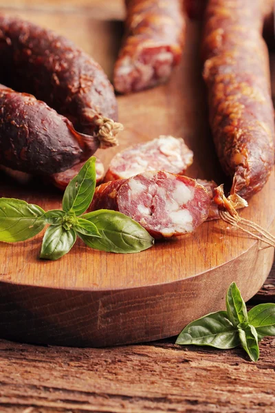 Fresh sausage on cutting board — Stock Photo, Image
