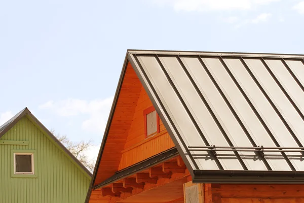 House with a roof made of metal sheets — Stock Photo, Image