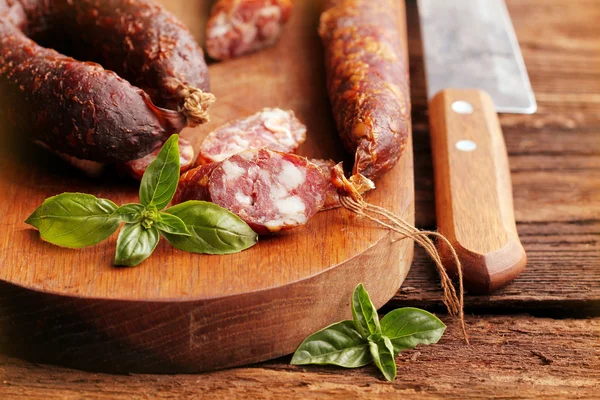 Sausage on cutting board — Stock Photo, Image