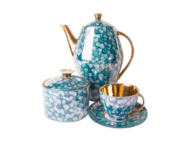 Vintage czajniczek, filiżanka do herbaty z talerzykiem i CUKIERNICA w stylu retro na białym Obrazek Stockowy