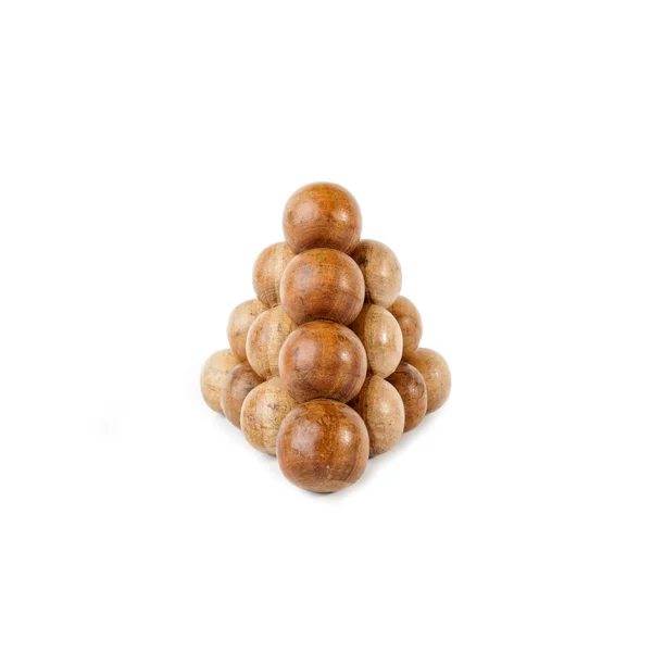 Pyramid built from wooden balls isolated over white background — Stock Photo, Image