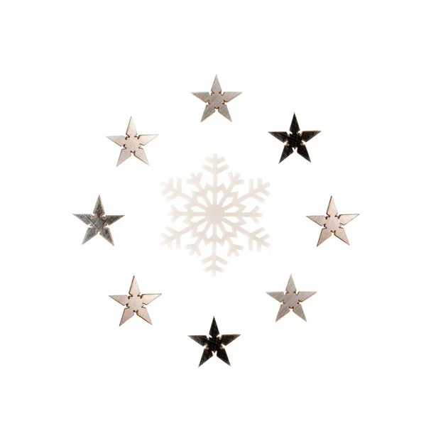 Snowflakes and stars around it isolated over white background — Stock Photo, Image