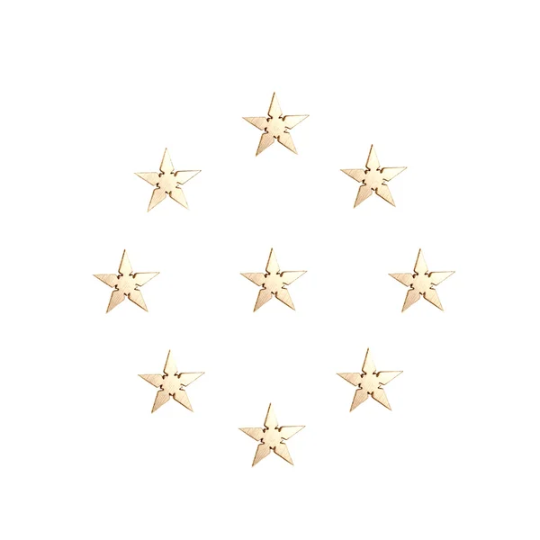 Złote gwiazdy na białym tle nad białym — Zdjęcie stockowe