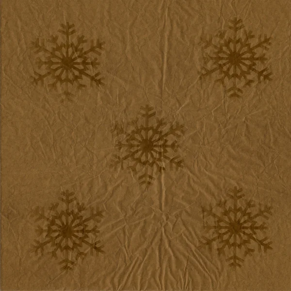Brown Packing Paper with snowflakes for background in old style — Stock Photo, Image