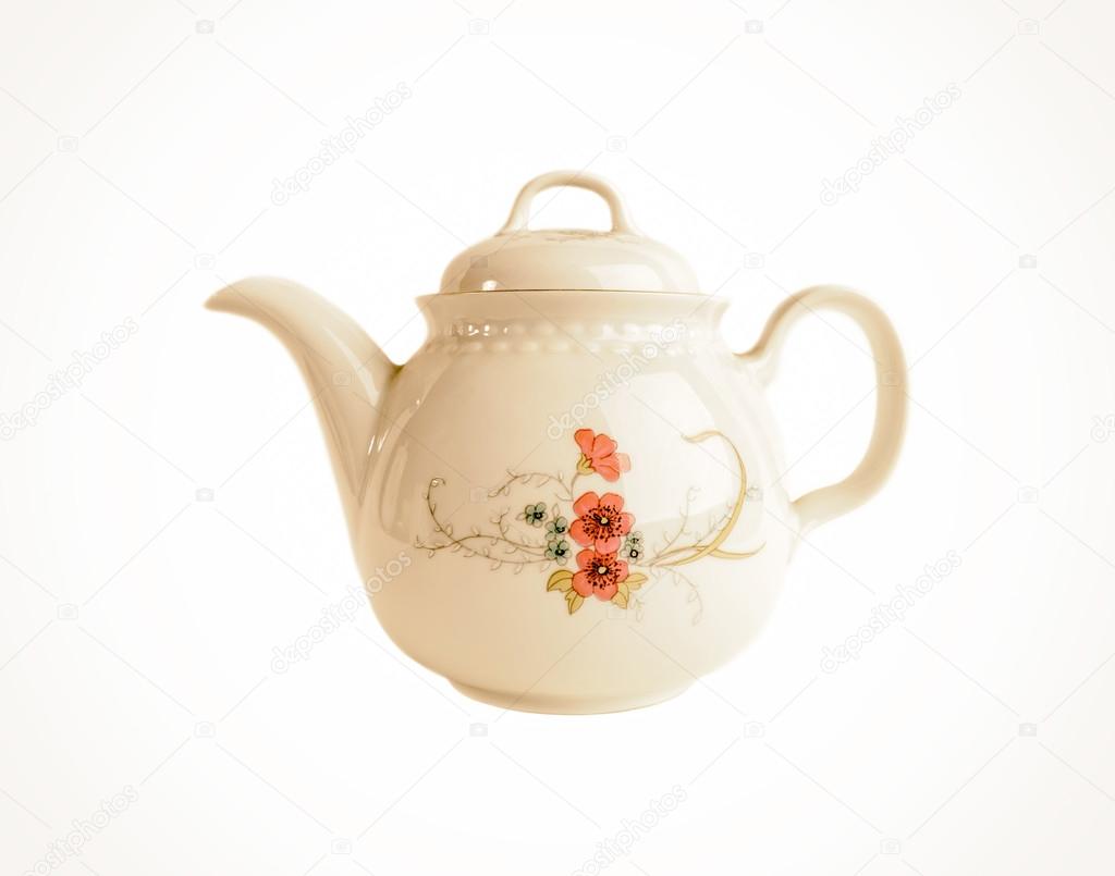 Porcelain teapot with floral patterns isolated in old style on white
