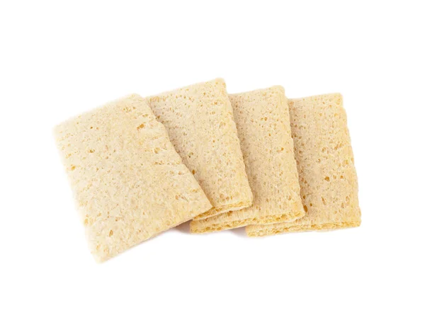 Rebanadas de pan crujiente sobre fondo blanco . — Foto de Stock