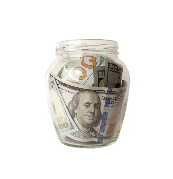 Dollars dans le bocal en verre isolé sur fond blanc — Photo
