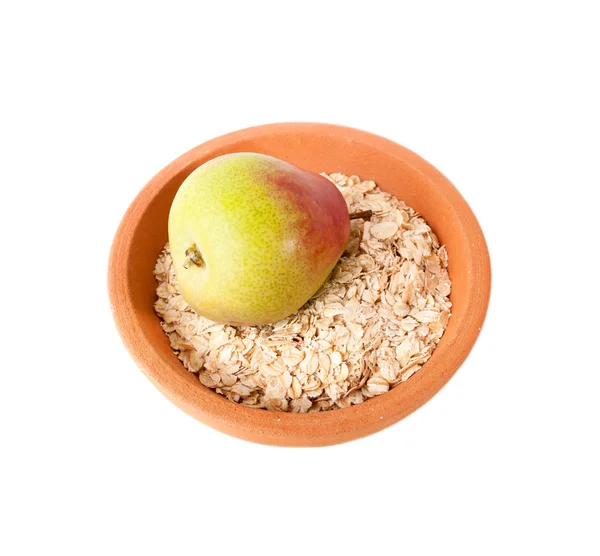 Oatmeal and pear in ceramic plate. Healthy lifestyle concept. — Stock Photo, Image