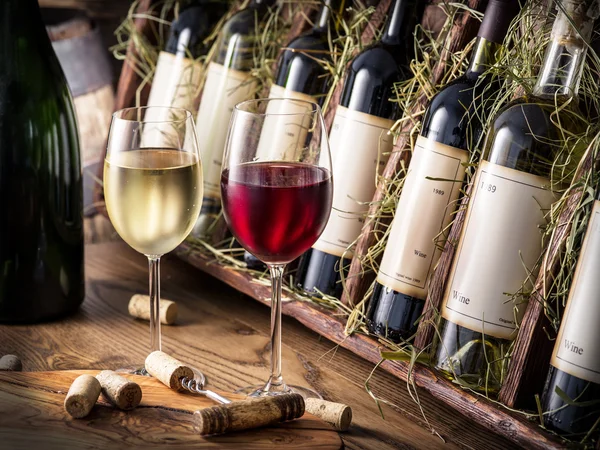 Wine bottles on the wooden shelf. — Stock Photo, Image