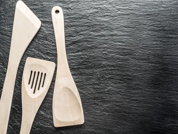 Kitchen utensils on the graphite background.