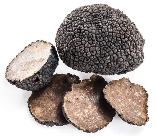 Zwarte truffels geïsoleerd op een witte achtergrond. — Stockfoto