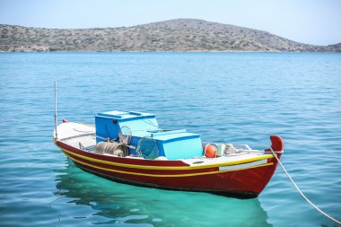 Fishing boats on the Elounda coast of The Crete. clipart