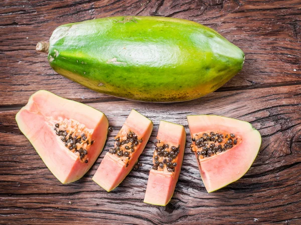 Papaya fruit on wooden background. — Stock Photo, Image