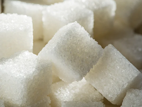 Close-up shot van witte raffinaderij suiker. — Stockfoto