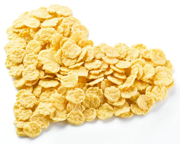 Cornflakes in Herzform angeordnet. — Stockfoto