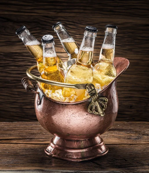 Cold bottles of beer in the brazen bucket. — Stock Photo, Image