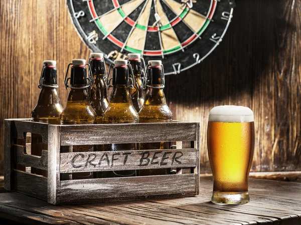 Crafting beer in bottles and glasses. — Stock Photo, Image