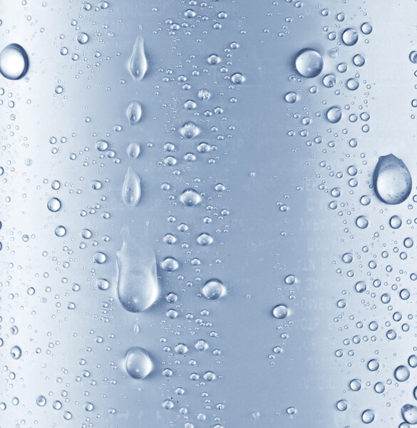 Water drops over blue glass background.