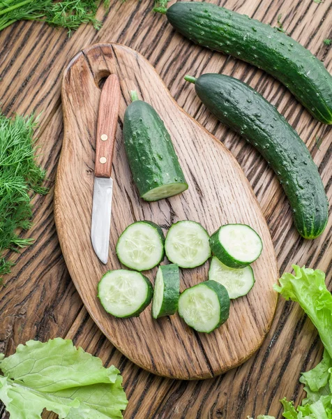 Cucumbers on the wooden table. — Stock Photo, Image