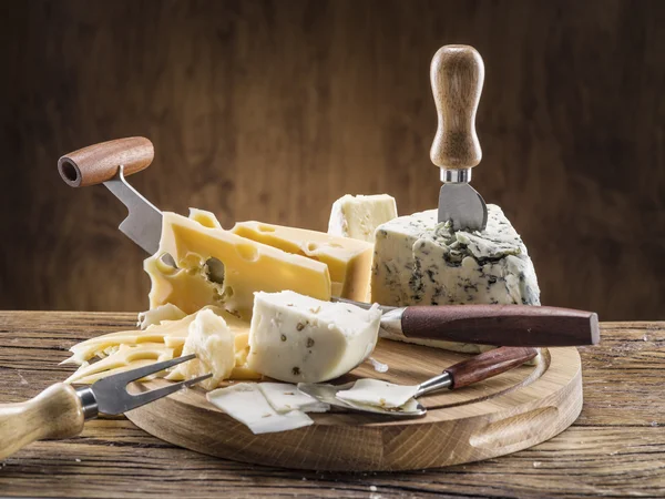 Variety of cheeses. Vintage stiles. — Stock Photo, Image