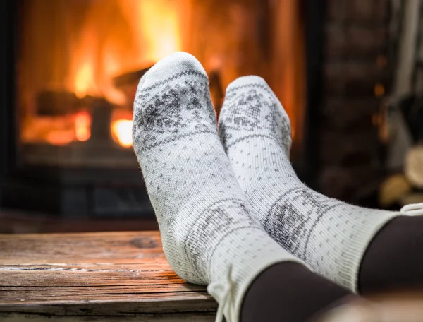 Warming and relaxing near fireplace. — Stock Photo, Image